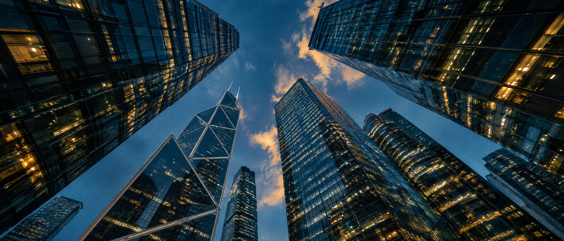 Looking up between office towers in Central at blue hour